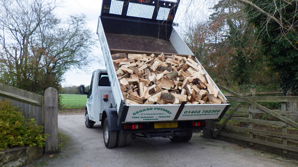 Photo of Traditionally Seasoned firewood on a Transit.